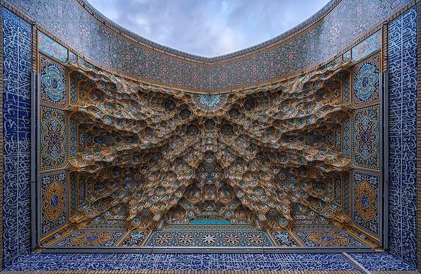 Decorative muqarnas vaulting in the iwan entrance of Fatima Masumeh Shrine in Atabki Sahn, Qom, Iran.
