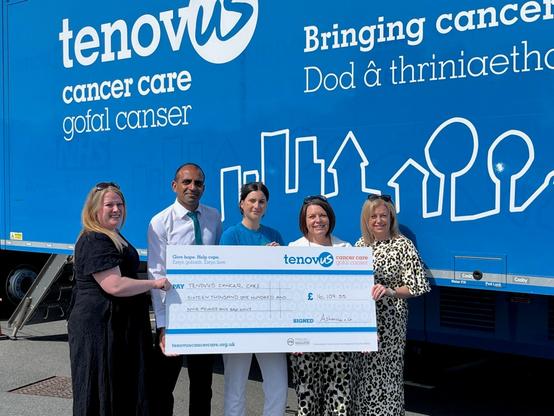 Ashmole & Co Partners handing over a cheque for £16,109.55 to Clare Davies, Regional Fundraising Manager for Tenovus Cancer Care outside one of the mobile support units. L-R: Ashmole & Co Partners - Christine Daultrey, Vinal Patel, with Clare Davies from Tenovus Cancer Care in the middle, Sharon George and Laura Craddock.