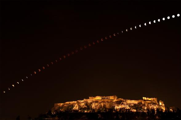 The total phase of the June 15, 2011 lunar eclipse lasted an impressive 100 minutes. Its entire duration is covered in this composite of a regular sequence of digital camera exposures, tracking the dark lunar disk as it arced above the Acropolis in Athens, Greece.