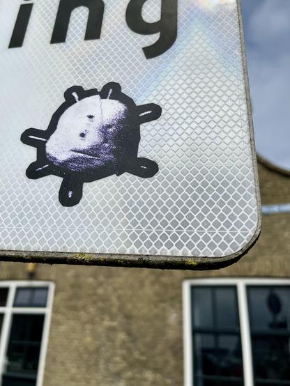 Custom cut sticker on reflective sign