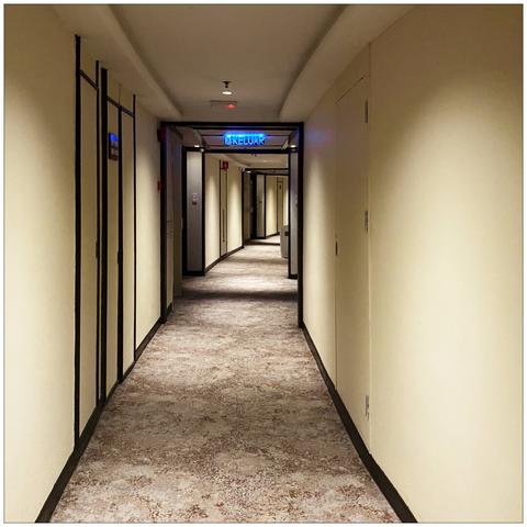 An empty hotel corridor.