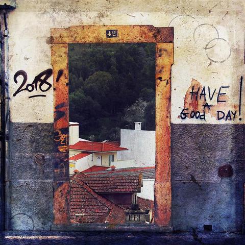 A graffity-sprayed blocked-up doorway with a "Have good day!" salute in Faro and a photo of a typical Portuguese roofscape with terracotta tiles and an oak and pine forest in the background, taken in Monchique, come together in a surrealist, urban grunge collage. Note the #42 above the doorway. I took both photos on a trip to the Algarve, Portugal in 2018.