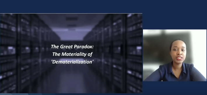 Snapshot of the video recording of Sandrine Elmi Hersi's talk showing a slide that says: "The Great Paradox: The Materiality of 'Dematerialization' "
