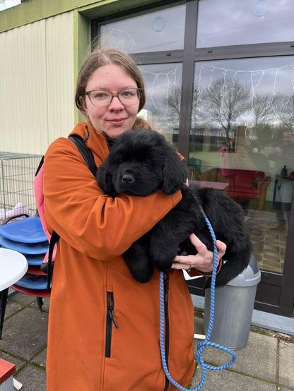Me holding Baby Odin the Newfie in March 2024