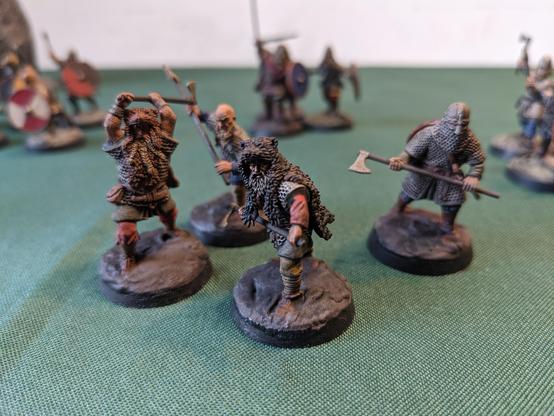 Several miniature vikings. Some are wearing bear skin headgear.