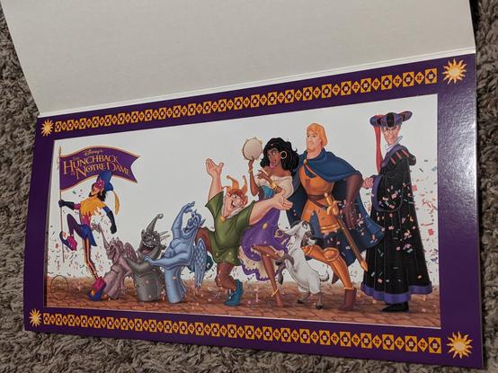 The lithograph in question, featuring characters from the movie like the three gargoyles, Quasimodo, Esmeralda, Phoebus, and Frolo all excitedly walking along the streets of Paris together.