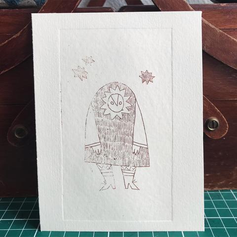 Postcard-sized print of a biped creature with an owl-like face, a big coat and tall boots