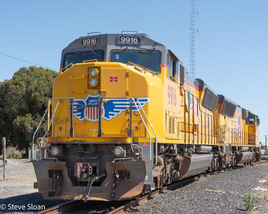 One Clipped Wing 
On Saturday, May 10, 2025, at CP CV036 Park, in Benicia, CA, Union Pacific (UP) 9916 and 9927 were waiting for work.
UP 9916 is an EMD SD32ECO (UP Designation SD59MX). Reportedly: it was built in 1992 by EMD as 6316, a model SD60M, builders number 926302-1. It was renumbered 2471, retired as such in 2011 and then it was rebuilt, repower serial number 20107425-002.