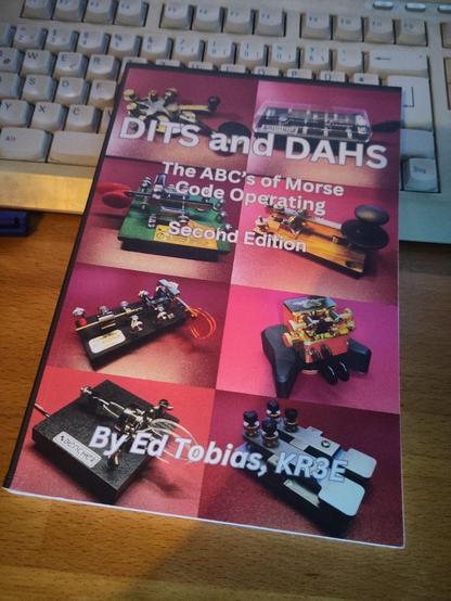 The cover of the book "DITS and DAHS" (The ABC's of Morse Code Operating - Second Edition) by Ed Tobias, KR3E.

The cover shows various Morse keys (J38, BK-100, Vibroplex, Begli, Bencher).