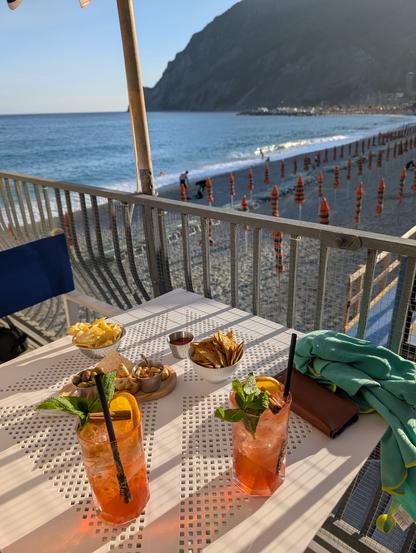 Cocktails on a table with beach in background