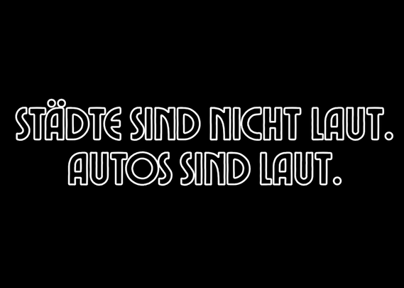 Weiße Schrift auf schwarzem Grund: Städte sind nicht laut. Autos sind laut.