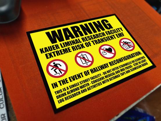 A backrooms themed sign warning of possible hallway reconfiguration