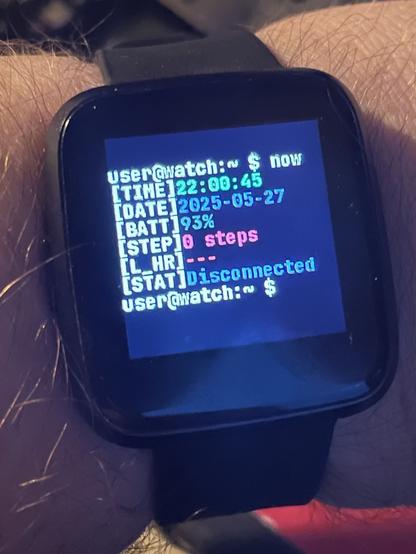 A picture of the PineTime watch on my wrist using the nerdy Terminal watch face