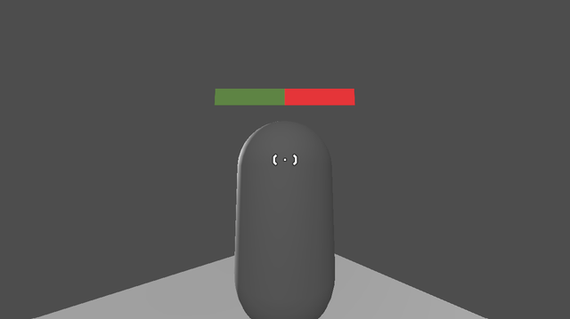 A grey capsule standing on a white platform and a grey background. A half green half red bar above it representing health.