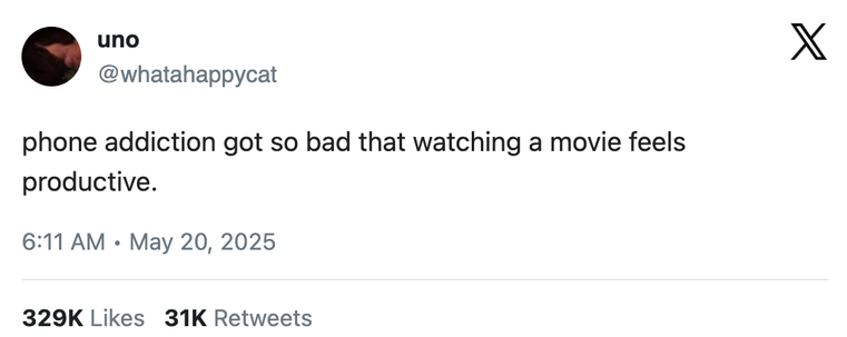 The tweet reads: "phone addiction got so bad that watching a movie feels productive."