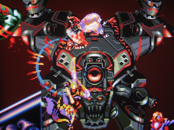 Osman gets owned by a villainous circus lady's rising tackle while a giant demon mech closes in.