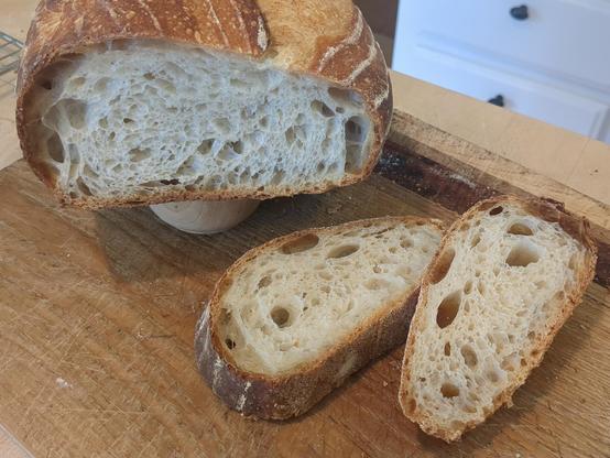 Sliced loaf and slices on a cutting board, showing the crumb.