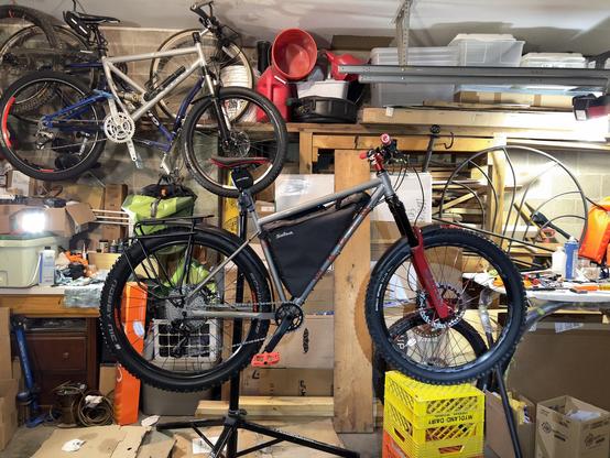 Photo showing progress on test fitting frame pack with internal mounts, fenders, and carrier rack