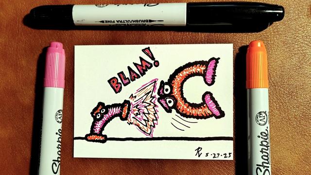 Marker drawing of a pair of Java Muppets, two creatures made of flexible corrugated tubes with eyes in the middle and furry feet on each end. The smaller pink one has raised one of its feet at the larger orange one and a gunshot explodes from it with a "BLAM!" sound effect, sending the orange one flying off the stage. The drawing is signed with my "RV" signature glyph and dated 5-27-25. The black, pink, and orange markers used to draw the image rest on the table around the card.