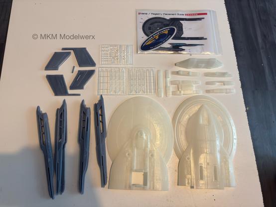 The model parts laid out on a white table.