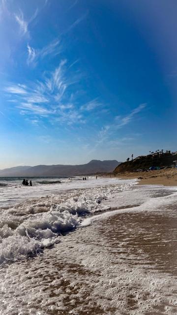 Waves crashing on the beach in Malibu