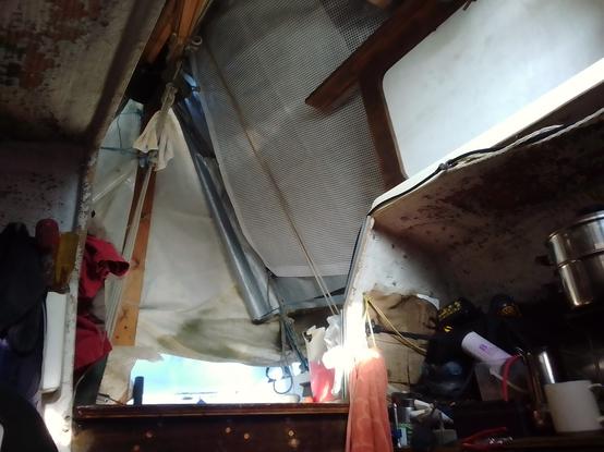 The cockpit tent obscuring a dry sunny morning as viewed from a reclining position below