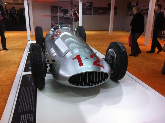Silver bodied open-wheel Mercedes W154 race car, frontal view