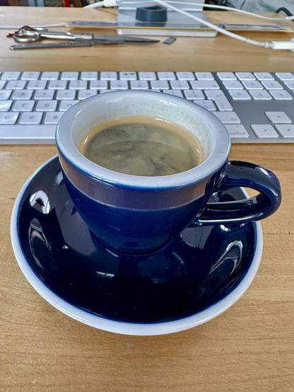 My favorite dark blue espresso cup. On my desk.
