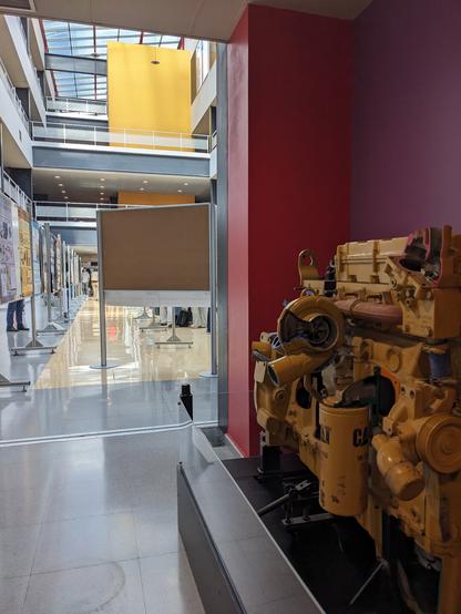 Interior of the building with a engine on show. You can tell it's an engineering building!