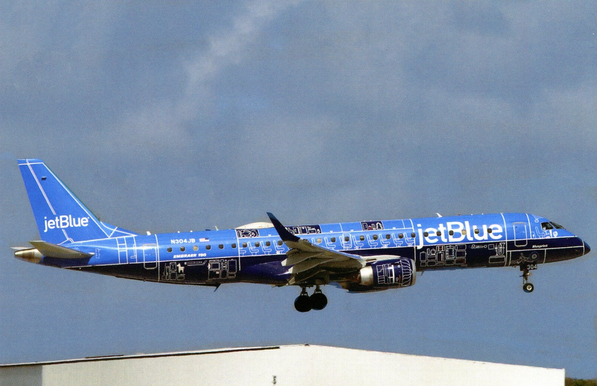 The plane is seen landing. This is the Blueprint livery and the plane is covered in an E190 blueprint.