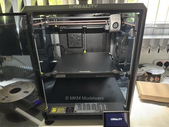 The inside of the printer showing the build plate half way up