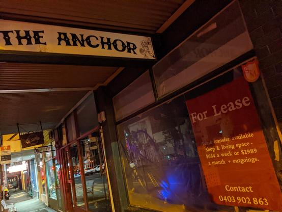 A photo of 'The Anchor' shop front with a 'for lease' sign in the window.