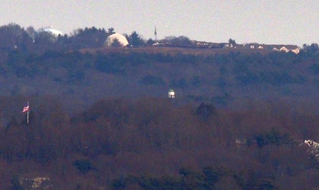 The dome of Hingham Town Hall, 210 Central St, Hingham MA photographed from Buck Hill.