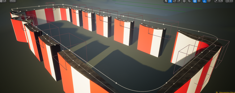 A screenshot of a track from my stunt racer (an old Commodore Amiga game) clone / prototype. The track is pretty much a rounded rectangle but there's a bunch of jumps splitting up the far side of the track and a squiggly, wiggly bit in the top left. The track is raised up from a green ground, so that if the player drives off they plunge to a (possibly) fiery demise.