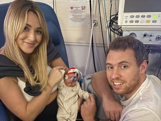 Nia and James with Noa in NICU