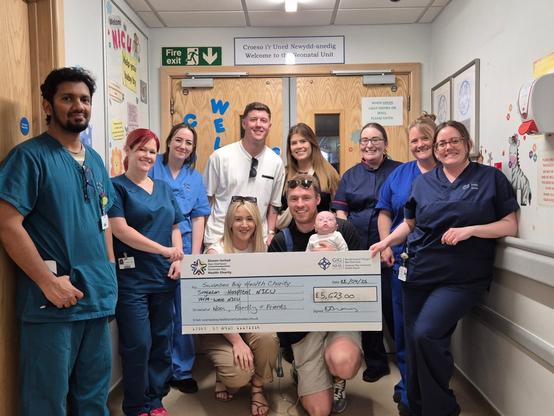 Cheque presentation to staff at the unit