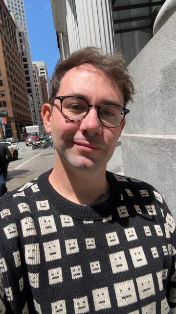me, a 30 something guy in a  cute sweater with little :| pipe face squares