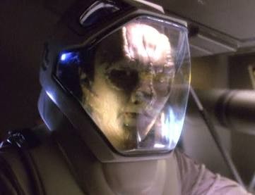 Garak in a space suit on a darkened space station