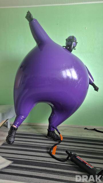 Big and round inflated purple hazmat suit