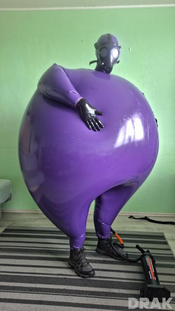 Big and round inflated purple hazmat suit