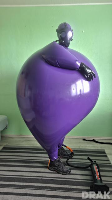Big and round inflated purple hazmat suit