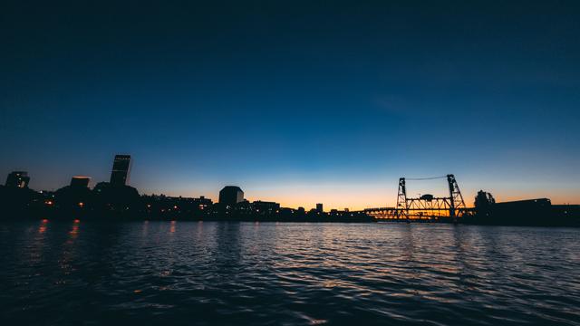 silhouette of the steel bridge and Portland city skyline