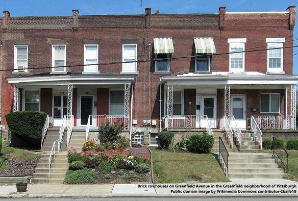 Four brick-built, 2-bay, 2 storey rowhouses (terraced housing)with steps, and small sloping gardens, leading to the sidewalk or pavement below.