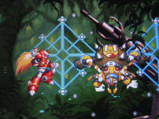 Zero leaps and prepares to slash the nefarious Web Spider in his electrified web.