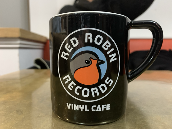 On-prem coffee mug from now defunct local record shop.
