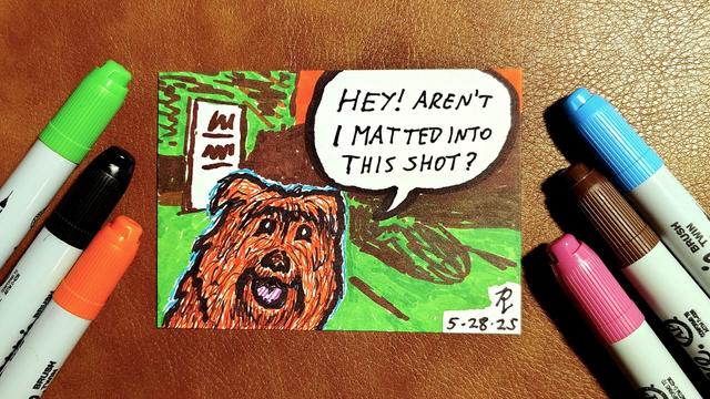 Marker drawing of a scene from the special "Secrets of the Muppets" episode of "The Jim Henson Hour" in which Jojo, a fluffy orange-brown dog, notices the shot she's in and asks "hey, aren't I matted into this shot?" The drawing is signed with my "RV" signature glyph and dated 5-28-25. The green, black, orange, blue, brown, and pink markers used to draw the image rest on the table around the card.