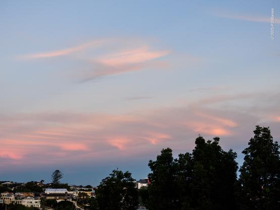 A very similar series of inverted-cone shaped clouds, also in a line, in almost the identical location to the first shot. I suspect now, given the identical location, that they are caused by local topography, possibly a reach on the river. (IANA meteorologist, physicist or fluid dynamics expert, but they line up with the next reach of the river)
