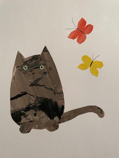 A tortoiseshell cat with green eyes watches a red and yellow butterfly. They are all cut out of hand, painted paper and appear on a white background of watercolor paper.