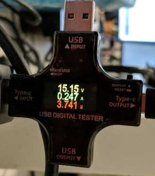 USB power tester, reading:

15.15 volts
0.247 amps
3.741 watts