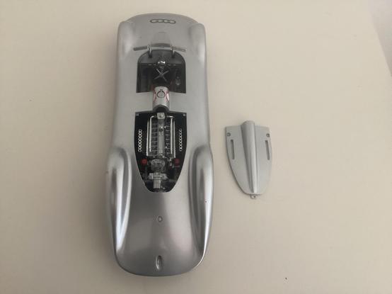 Silver Auto Union Typ C Stromlinie, Revell 1:18 model, rear view from above, showing open driver’s compartment and engine cover